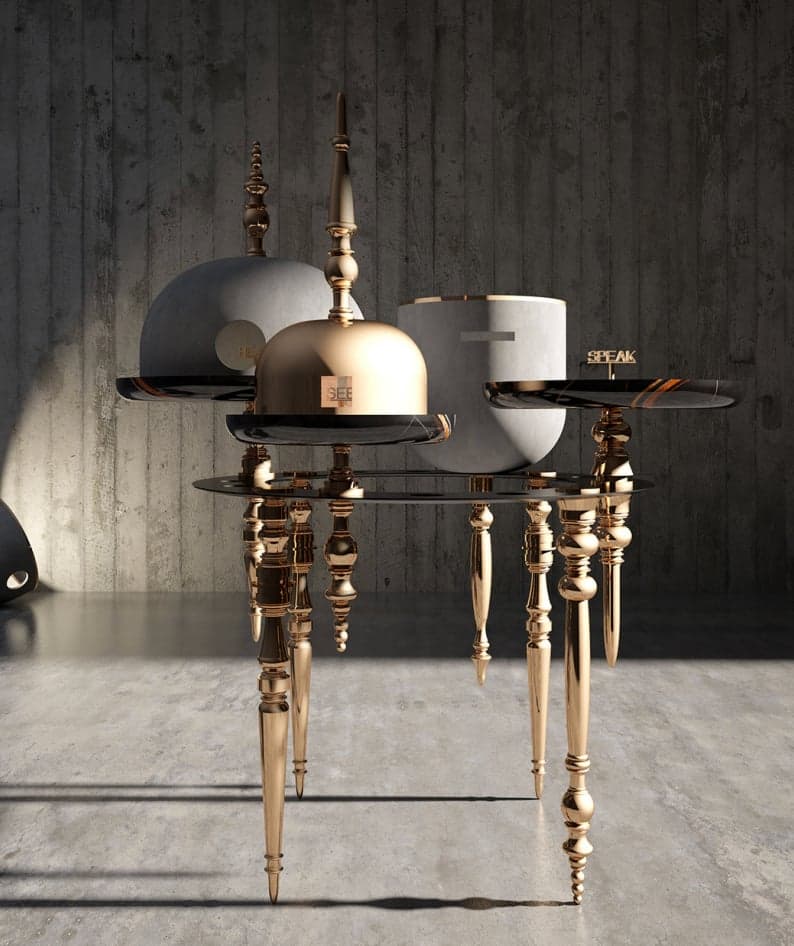 A brass tea service on tall turned legs